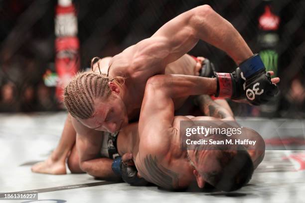 Paddy Pimblett of England punches Tony Ferguson of the United States in a lightweight fight during the UFC Fight Night event at T-Mobile Arena on...