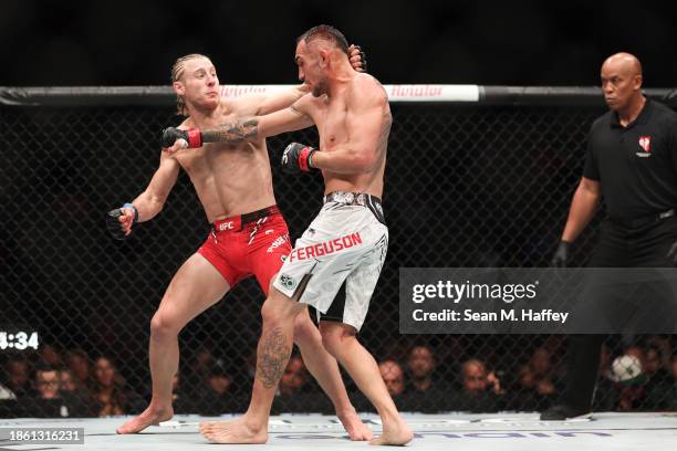 Paddy Pimblett of England punches Tony Ferguson of the United States in a lightweight fight during the UFC Fight Night event at T-Mobile Arena on...