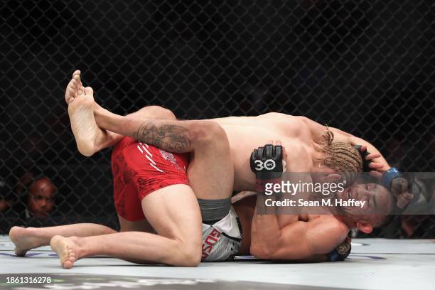 Paddy Pimblett of England wrestles Tony Ferguson of the United States in a lightweight fight during the UFC Fight Night event at T-Mobile Arena on...