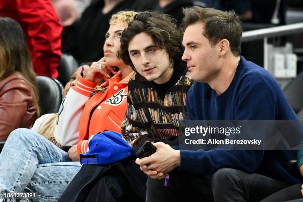 Timothée Chalamet and Ryan Friedkin attend a basketball game between the Los Angeles Clippers and the New York Knicks at Crypto.com Arena on December...