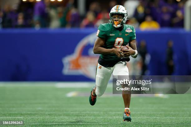 Kelvin Dean of the Florida A&M Rattlers runs the ball for a touchdown against the Howard Bison during the second half of the Cricket Celebration Bowl...