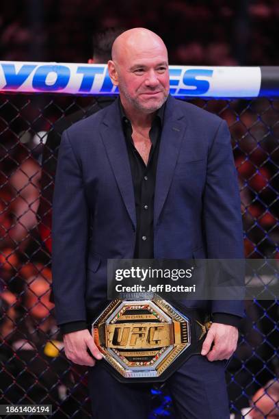 Dana White holds the championship belt in the Octagon during the UFC 296 event at T-Mobile Arena on December 16, 2023 in Las Vegas, Nevada.
