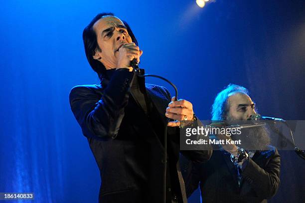 Nick Cave and Warren Ellis performs with The Bad Seeds at Hammersmith Apollo on October 28, 2013 in London, England.