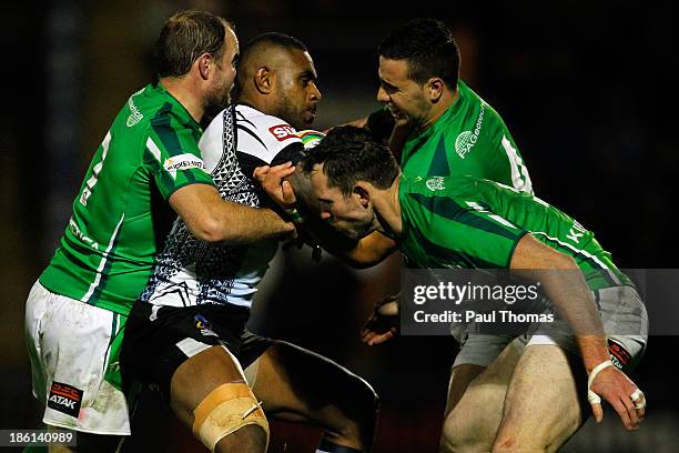 Waisale Ligani Naiqama of Fiji is tackled by Liam Finn , Pat Richards and Apirana Pewhairangi of Ireland during the Rugby League World Cup Group A...