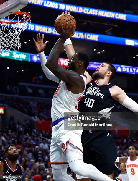 Julius Randle of the New York Knicks takes a shot against Ivica Zubac of the LA Clippers in the second half at Crypto.com Arena on December 16, 2023...