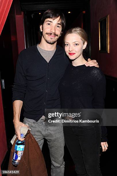 Actors Justin Long and Amanda Seyfried attend LAByrinth Theater Company Celebrity Charades 2013 Benefit Gala on October 28, 2013 in New York City.