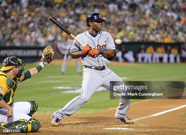 Torii Hunter of the Detroit Tigers reacts to an inside pitch during Game Two of the American League Division Series against the Oakland Athletics at...