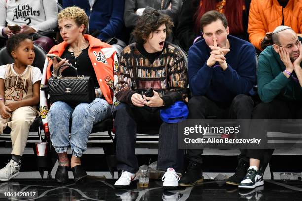 Timothée Chalamet and Ryan Friedkin attend a basketball game between the Los Angeles Clippers and the New York Knicks at Crypto.com Arena on December...