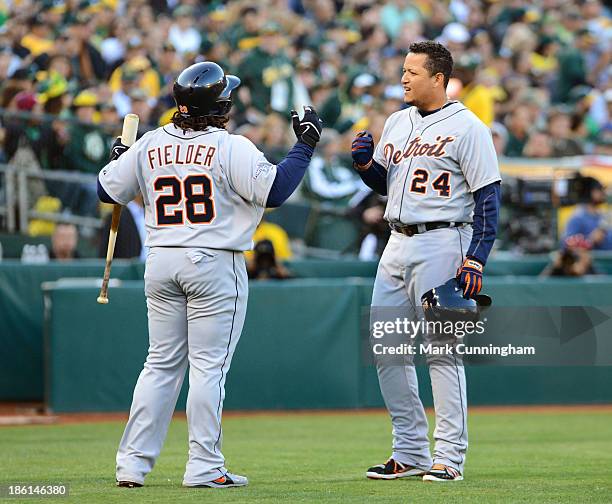 Miguel Cabrera of the Detroit Tigers celebrates his two-run home run in the fourth inning with Prince Fielder during Game Five of the American League...