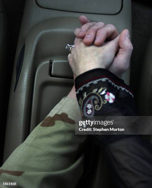 Tamara and Noel Nicolle share a private moment in their car before he deploys to Kuwait January 10, 2003 in Ft. Stewart, Georgia. Noel is a U.S. Army...