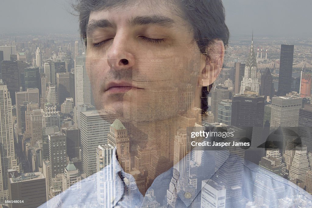 Composite image of man and cityscape