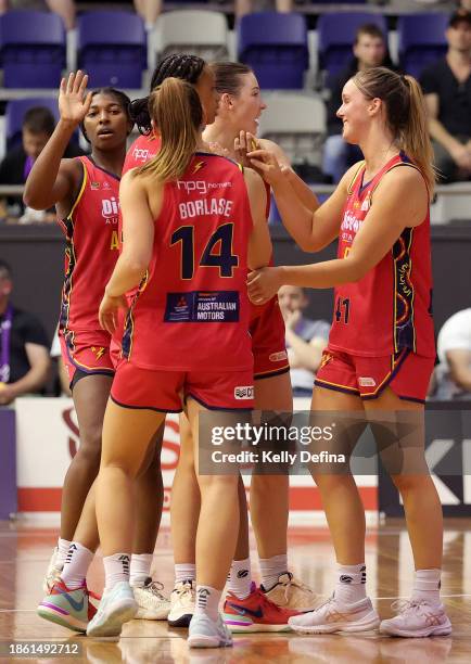 Adelaide players celebrate the win during the WNBL match between Melbourne Boomers and Adelaide Lightning at Melbourne Sports Centres - Parkville, on...