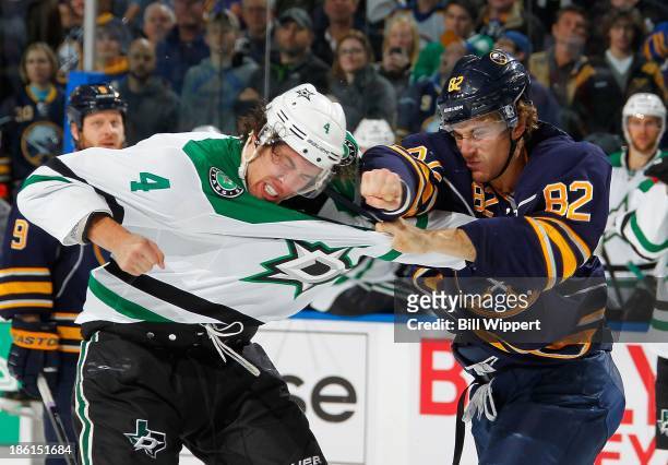Marcus Foligno of the Buffalo Sabres fights Brenden Dillon of the Dallas Stars on October 28, 2013 at the First Niagara Center in Buffalo, New York.