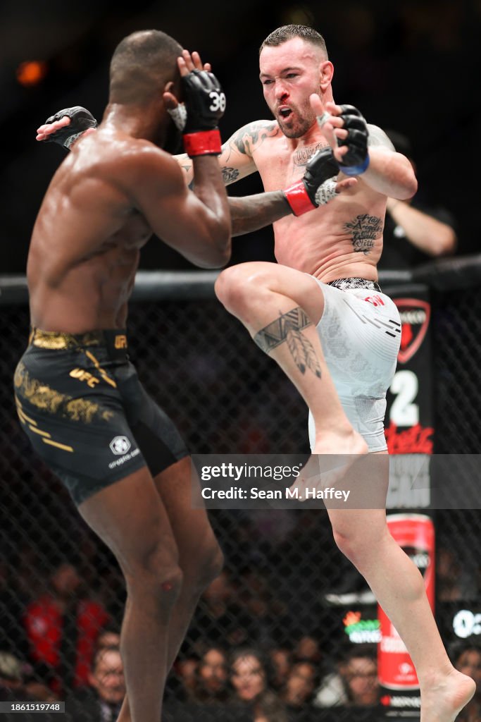 Colby Edwards Colby Covington of the United States kicks Leon Edwards of England in ...