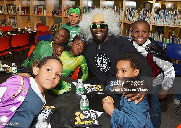 Brooklyn Nets' Reggie Evans hosts a Halloween Monster Mash for 50 kids at The Brooklyn Children's Museum on October 28, 2013 in New York City.
