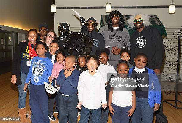 Nets Super Hero BrooklyKnight, Brooklyn Nets' Reggie Evans, Andray Blatche and Tyshawn Taylor host a Halloween Monster Mash for 50 kids at The...