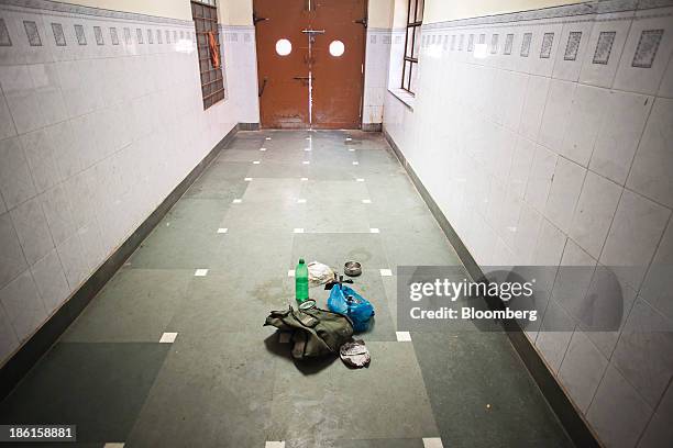 Personal belongings of a patient's relative sit in a corridor at the Acharya Tulsi Regional Cancer Treatment & Research Institute in Bikaner,...