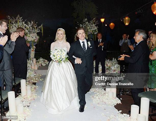 Holly Madison and Pasquale Rotella during their wedding ceremony at Disneyland on September 10, 2013 in Anaheim, California.