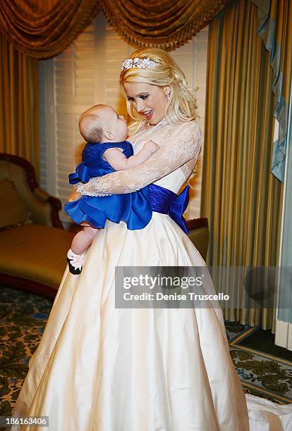 Holly Madison poses for photos with her daughter Rainbow Rotella before her wedding at Disneyland on September 10, 2013 in Anaheim, California.