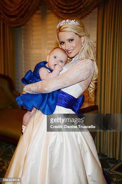 Holly Madison poses for photos with her daughter Rainbow Rotella before her wedding at Disneyland on September 10, 2013 in Anaheim, California.