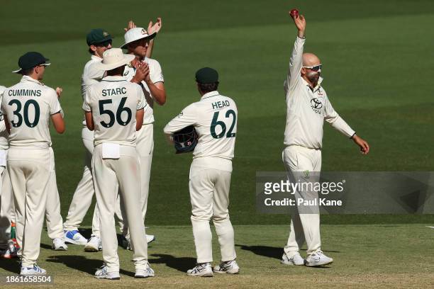 Nathan Lyon of Australia celebrates dismissing Faheem Ashraf of Pakistan following a DRS review and taking his 500th test wicket during day four of...