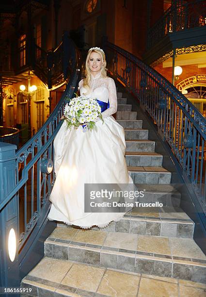 Holly Madison poses for photos before her wedding at Disneyland on September 10, 2013 in Anaheim, California.