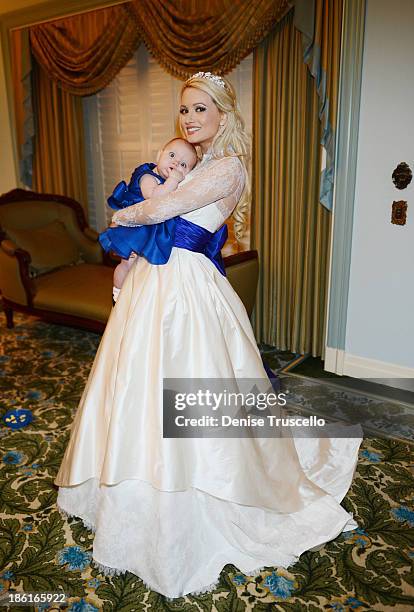 Holly Madison poses for photos with her daughter Rainbow Rotella before her wedding at Disneyland on September 10, 2013 in Anaheim, California.