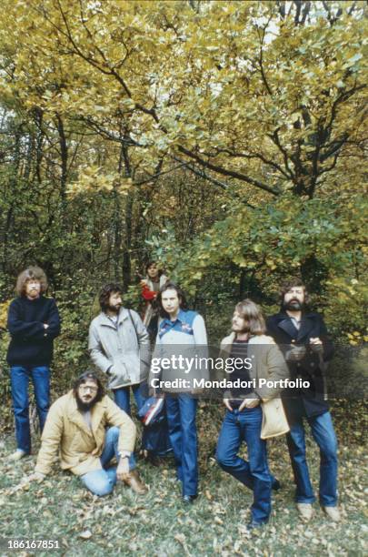 Italian musician, singer-songwriter and writer Francesco Guccini posing with the Italian band Nomadi. The band is formed by Italian keyboard player...
