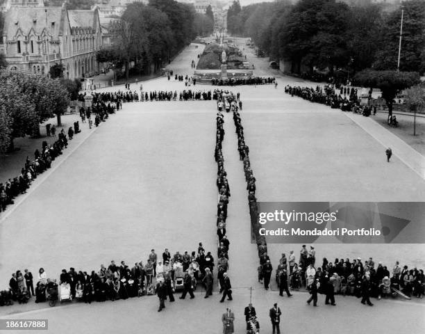 People going in procession in the square of the basilica of Our Lady of the Rosary during the centenary of the apparitions of Our Lady to Saint...