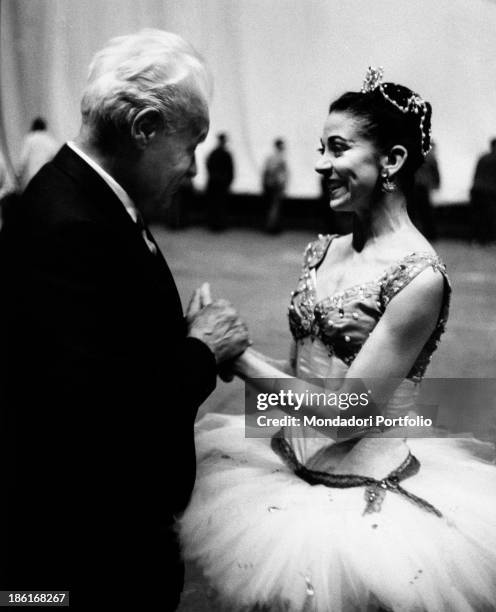 The Superintendent of La Scala Theatre Antonio Ghiringhelli gripping her hands and congratulating British ballet dancer Margot Fonteyn . Margot...