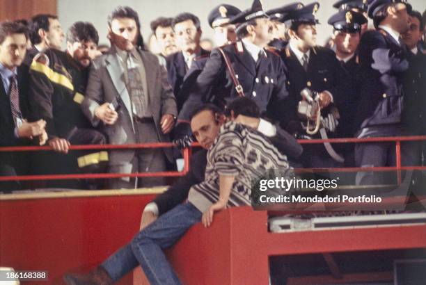 Italian presenter Pippo Baudo convincing the aspiring suicide Pino Pagano of coming down from the ledge at the 45th Sanremo Music Festival. Sanremo,...