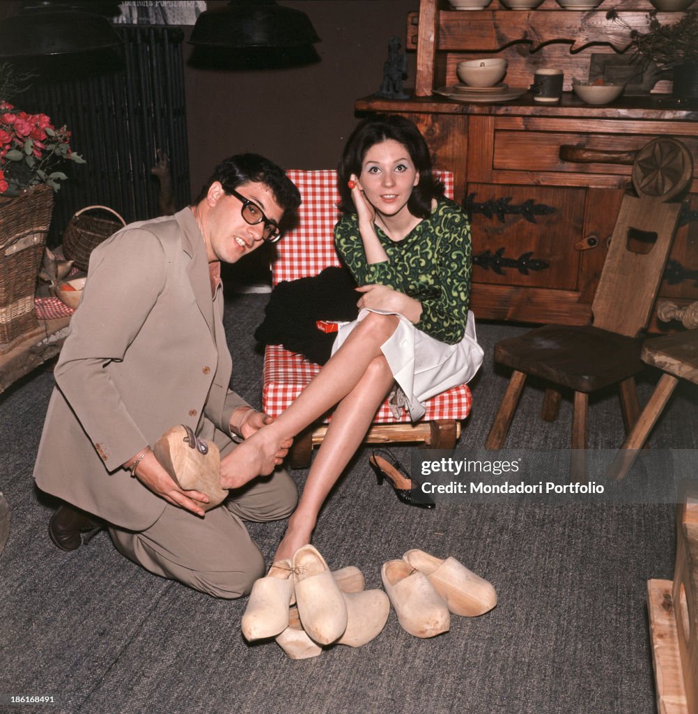 Peppino di Capri and Roberta Stoppa trying clogs