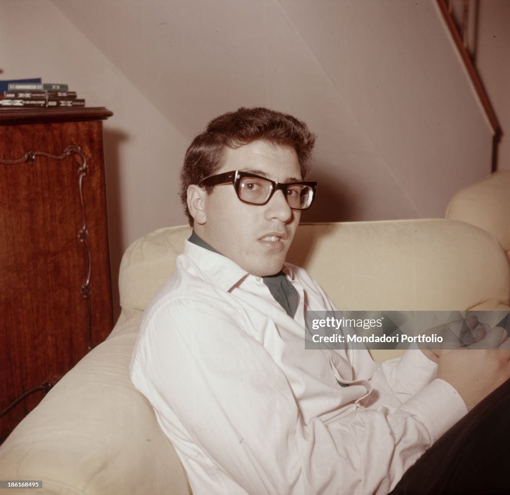 Peppino di Capri on a sofa