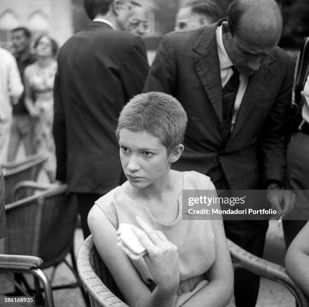 Italian actress Carla Gravina eating a sandwich at the International Film Festival. She shaved her hair for the film Five Branded Women. Venice,...