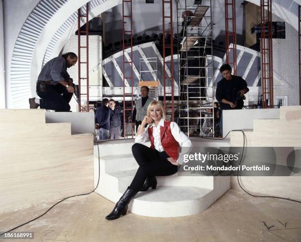 Italian TV presenter, actress, singer and showgirl Raffella Carrà posing in the on site studios of the TV show Carràmba! Che sorpresa. Rome, 1995.