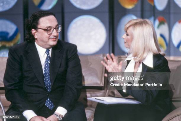 Italian TV host, actress, singer and showgirl Raffaella Carrà talking to Italian politician and Minister of the Foreign Affairs of the Italian...