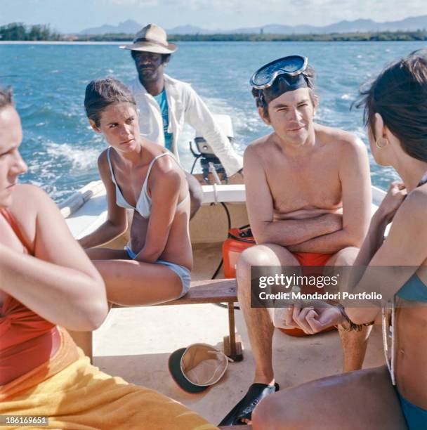 South African surgeon Christiaan Barnard and his wife Barbara Zoellner taking a trip on a motorboat. Republic of South Africa, 1977.