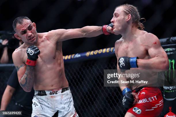 Paddy Pimblett of Great Britain is punched by Tony Ferguson of the United States in a lightweight fight during the UFC 296 Edwards vs. Covington...