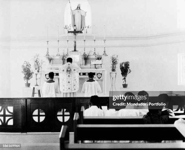 People attending the mass. Malaysia, 1950s.