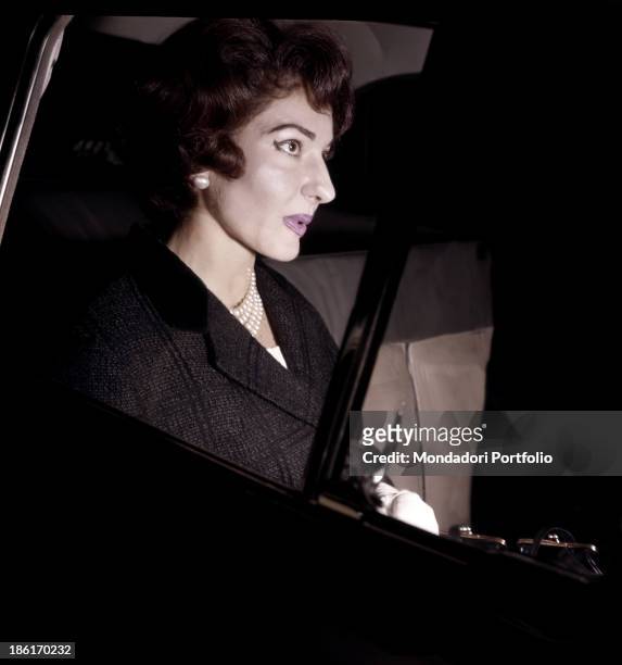Greek-born American soprano Maria Callas sitting in a car just out of La Scala Theatre, Milan, 1958.