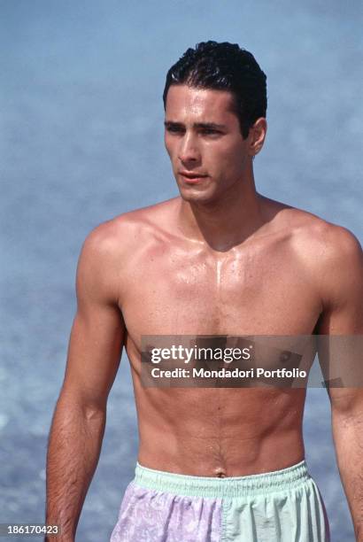 Italian actor Raoul Bova wearing a swimsuit in the film Piccolo grande amore. Italy, 1993.