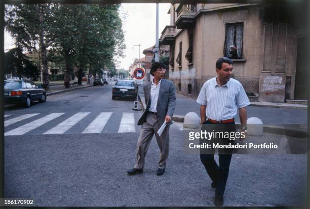 Italian politician Umberto Bossi, founder of the Lega Lombarda then Lega Nord, walking down a streat with Italian politician Francesco Enrico...