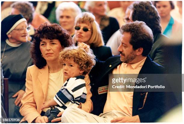 Italian politician Roberto Maroni, founder of the Lega Lombarda then Lega Nord with Italian politician Umberto Bossi, sitting next to his wife,...