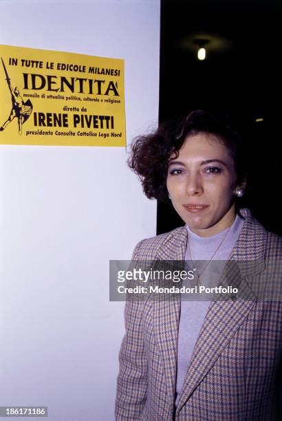 Italian politician and President of the Catholic Council of the Lega Nord Irene Pivetti posing beside an advertising sign of the monthly magazine...