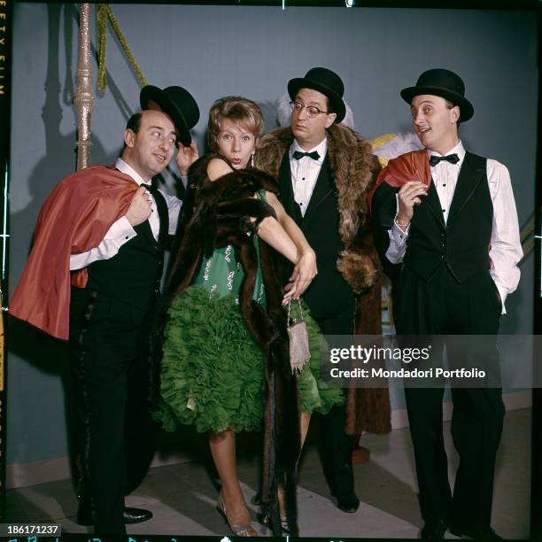 Members of the Quartetto Cetra posing wearing stage costumes. The band is formed by Italian singer and drummer Felice Chiusano, Italian singer and...