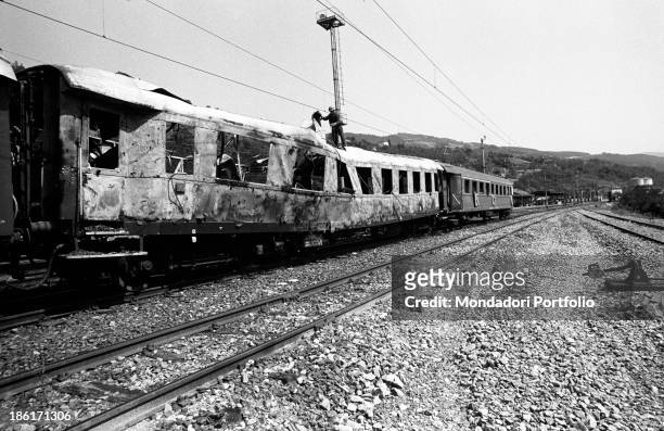 Lateral sight of the passenger car of the Italicus Express, running from Rome to Munich that has been gutted by an explosion on the Bologna-Florence...