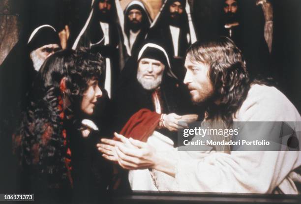 British actor Robert Powell tenderly looking into the eyes Italo-American actress Anne Bancroft in the TV mini-series Jesus of Nazareth. 1977.