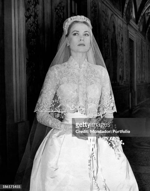 The big movie star Grace Kelly photographed in her bridal dress in a frescoed gallery within the Prince's Palace, just before the wedding ceremony...