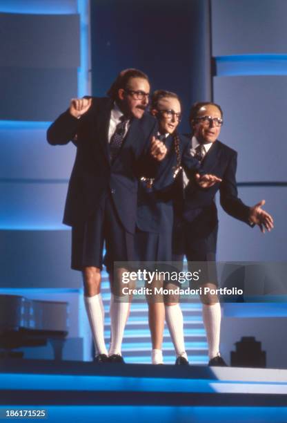 Italian actors and comedians Massimo Lopez, Tullio Solenghi and Anna Marchesini dancing and singing at 39th Sanremo Music Festival. The Trio parody...