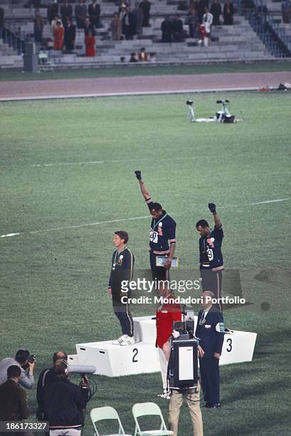 The american sprinters Tommie Smith,John Carlos and Peter Norman during the award ceremony of the 200 m race at the Mexican Olympic games. During the...